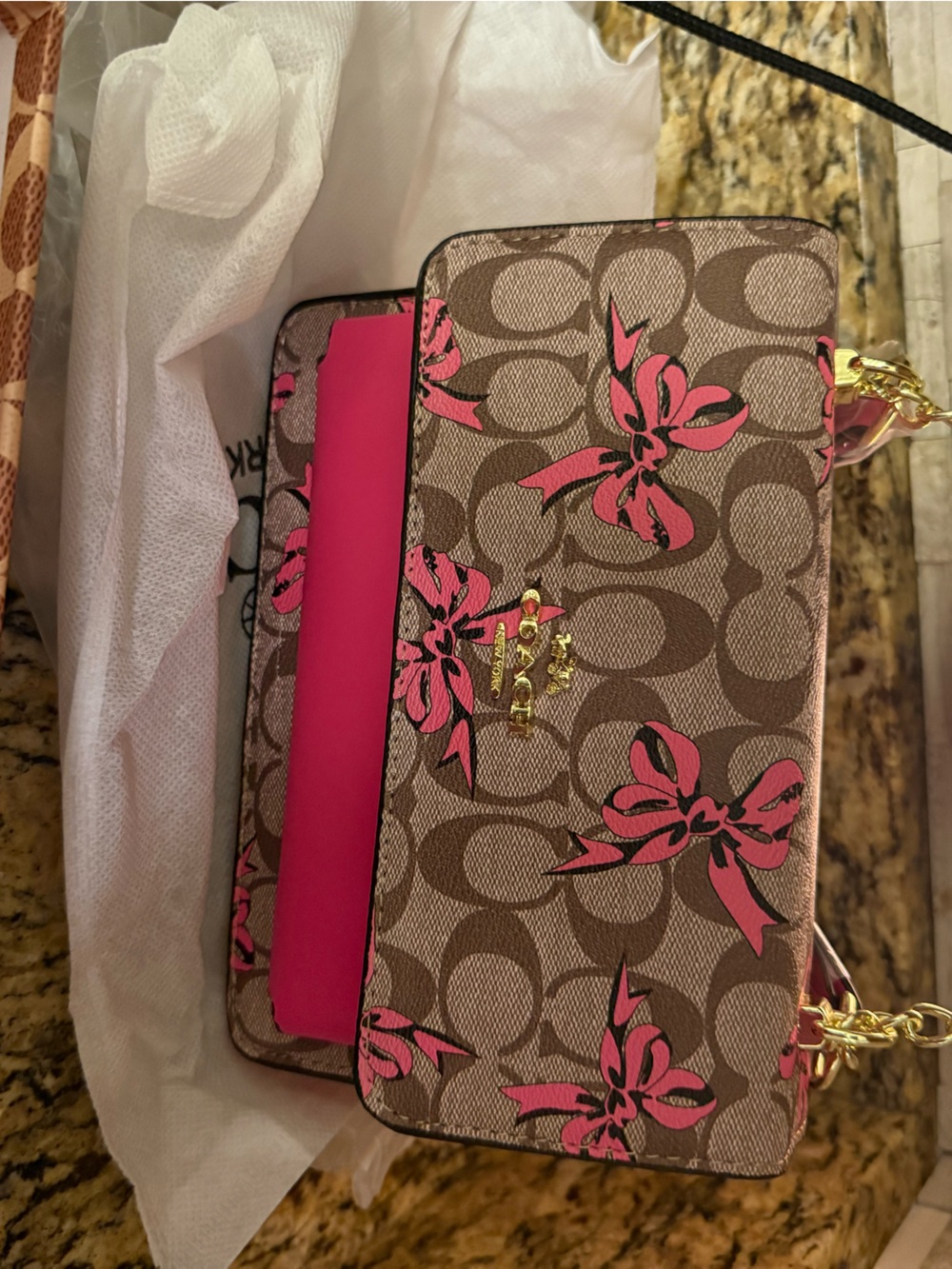 Coach Brown Signature Canvas Crossbody with Pink Floral Accents